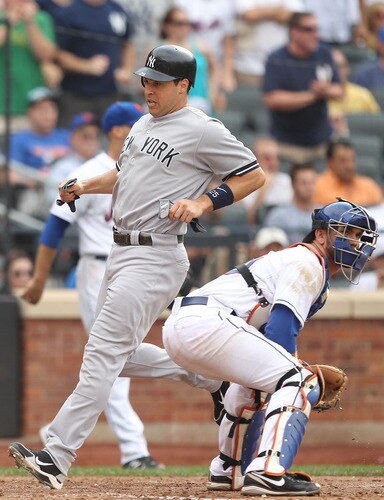 NEW YORK, NY - JULY 02:  Mark Teixeira #25 of the New York Yankees scores a run against Josh Thole #30 of the New York Mets during their game on July 2, 2011 at Citi Field in the Flushing neighborhood of the Queens borough of New York City.  <br /><br /><span class="help">(Photo by Al Bello/Getty Images)</span>