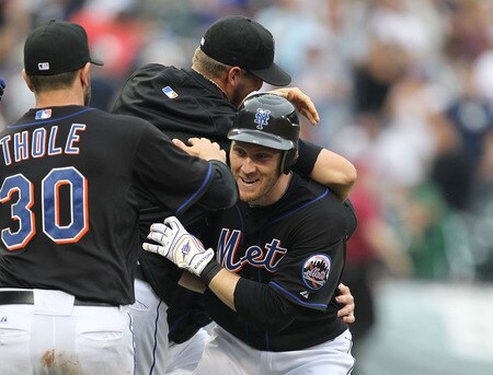 NEW YORK, NY - JULY 03:  Jason Bay #44 of the New York Mets is mobbed by teamates after hitting a walk off game winning single in the tenth inning against the New York Yankees on July 3, 2011 at Citi Field in the Flushing neighborhood of the Queens borough of New York City.  <br /><br /><span class="help">(Photo by Al Bello/Getty Images)</span>
