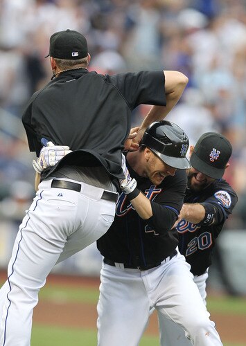 NEW YORK, NY - JULY 03:  Jason Bay #44 of the New York Mets is mobbed by teamates after hitting a walk off game winning single in the tenth inning against the New York Yankees on July 3, 2011 at Citi Field in the Flushing neighborhood of the Queens borough of New York City.  <br /><br /><span class="help">(Photo by Al Bello/Getty Images)</span>