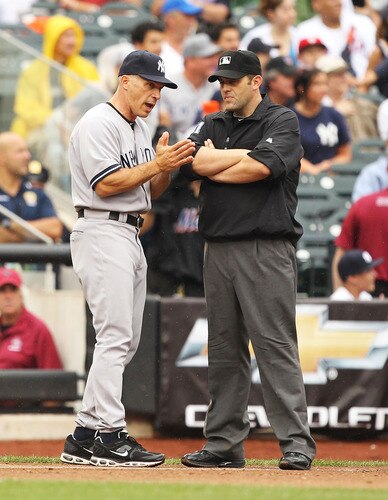 NEW YORK, NY - JULY 03:  Manager, Joe Girardi #8 of the New York Yankees argues a call with Umpire Brian Knight during their game on July 3, 2011 at Citi Field in the Flushing neighborhood of the Queens borough of New York City.  <br /><br /><span class="help">(Photo by Al Bello/Getty Images)</span>