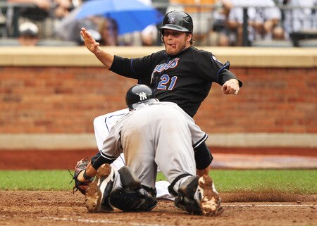 NEW YORK, NY - JULY 03:  Lucas Duda #21 of the New York Mets is tagged out by Russell Martin #55 of the New York Yankees in the ninth inning of their game on July 3, 2011 at Citi Field in the Flushing neighborhood of the Queens borough of New York City.  <br /><br /><span class="help">(Photo by Al Bello/Getty Images)</span>
