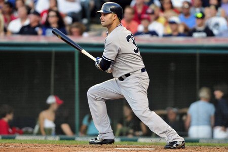 CLEVELAND, OH - JULY 4: Nick Swisher #33 of the New York Yankees hits a two run RBI double during the seventh inning against the Cleveland Indians at Progressive Field on July 4, 2011 in Cleveland, Ohio. <br /><br /><span class="help">(Photo by Jason Miller/Getty Images)</span>