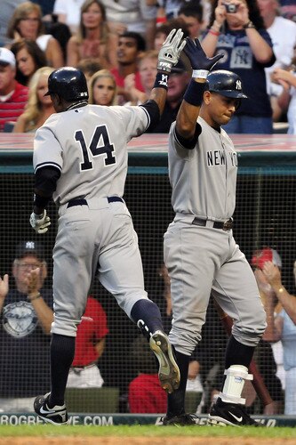 CLEVELAND, OH - JULY 4: Curtis Granderson #14 celebrates with Alex Rodriguez #13 of the New York Yankees after Granderson's solo home run during the eighth inning against the Cleveland Indians at Progressive Field on July 4, 2011 in Cleveland, Ohio. <br /><br /><span class="help">(Photo by Jason Miller/Getty Images)</span>