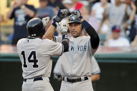 CLEVELAND, OH - JULY 5: Curtis Granderson #14 celebrates with Derek Jeter #2 of the New York Yankees after Granderson's two-run home run during the second inning against the Cleveland Indians at Progressive Field on July 5, 2011 in Cleveland, Ohio. <br /><br /><span class="help">(Photo by Jason Miller/Getty Images)</span>