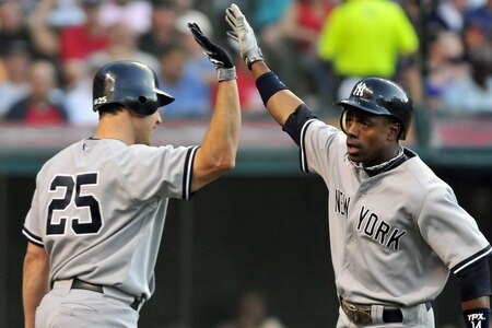 CLEVELAND, OH - JULY 5: Mark Teixeira #25 celebrates with Curtis Granderson #14 of the New York Yankees after Granderson's second home run of the night during the third inning against the Cleveland Indians at Progressive Field on July 5, 2011 in Cleveland, Ohio. <br /><br /><span class="help">(Photo by Jason Miller/Getty Images)</span>