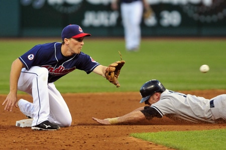 CLEVELAND, OH - JULY 5: Brett Gardner #11 of the New York Yankees slides safely into second as Cord Phelps #35 of the Cleveland Indians waits for the throw during the fifth inning at Progressive Field on July 5, 2011 in Cleveland, Ohio. <br /><br /><span class="help">(Photo by Jason Miller/Getty Images)</span>