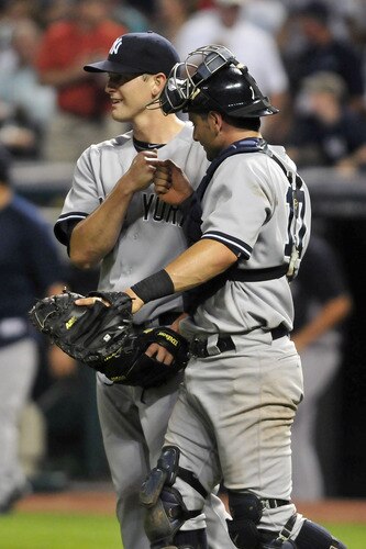 CLEVELAND, OH - JULY 5: Lance Pendleton #39 is congratulated by teammate Francisco Cervelli #17 of the New York Yankees after the Yankees defeated the Indians 9-2 at Progressive Field on July 5, 2011 in Cleveland, Ohio. <br /><br /><span class="help">(Photo by Jason Miller/Getty Images)</span>