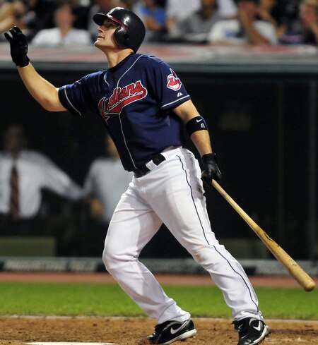 CLEVELAND, OH - JULY 5: Lou Marson #6 of the Cleveland Indians hits a sacrifice fly to score teammate Grady Sizemore #24 (not shown) during the ninth inning against the New York Yankees  at Progressive Field on July 5, 2011 in Cleveland, Ohio. The Yankees defeated the Indians 9-2. <br /><br /><span class="help">(Photo by Jason Miller/Getty Images)</span>