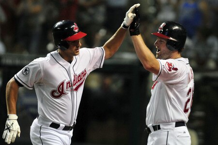 CLEVELAND, OH - JULY 6: Lonnie Chisenhall #27 of the Cleveland Indians celebrates with teammate Austin Kearns #26 after Chisenhall's solo home run during the eighth inning against the New York Yankees at Progressive Field on July 6, 2011 in Cleveland, Ohio. <br /><br /><span class="help">(Photo by Jason Miller/Getty Images)</span>