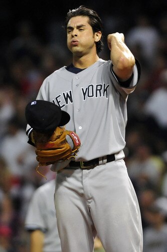 CLEVELAND, OH - JULY 6: Relief pitcher Sergio Mitre #45 of the New York Yankees reacts after walking in a run during the eighth inning against the Cleveland Indians at Progressive Field on July 6, 2011 in Cleveland, Ohio. <br /><br /><span class="help">(Photo by Jason Miller/Getty Images)</span>