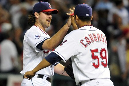 CLEVELAND, OH - JULY 6: Closing pitcher Chris Perez #54 of the Cleveland Indians celebrates with teammate Carlos Carrasco #59 after defeating the Yankees 5-3 to take the series 2-1 at Progressive Field on July 6, 2011 in Cleveland, Ohio. <br /><br /><span class="help">(Photo by Jason Miller/Getty Images)</span>