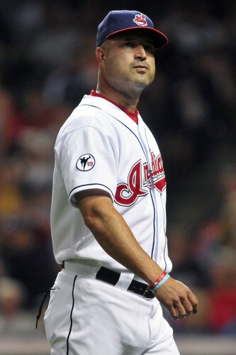 CLEVELAND, OH - JULY 6: Manny Acta #11 of the Cleveland Indians walks back to the dugout after a pitching change during the ninth inning against the New York Yankees at Progressive Field on July 6, 2011 in Cleveland, Ohio. The Indians defeated the Yankees 5-3 to take the series 2-1. <br /><br /><span class="help">(Photo by Jason Miller/Getty Images)</span>