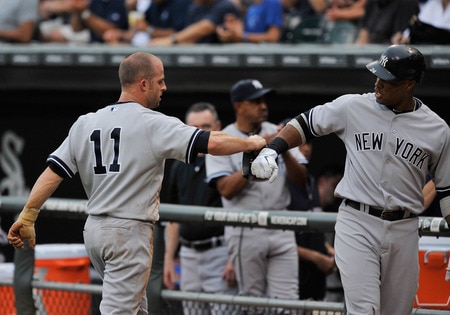 CHICAGO, IL - AUGUST 01: Brett Gardner #11 of the New York Yankees is greeted by Curtis Granderson #14 after scoring in the first inning against the Chicago White Sox on August 1, 2011 at U.S. Cellular Field in Chicago, Illinois.  <br /><br /><span class="help">(Photo by David Banks/Getty Images)</span>