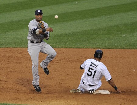 CHICAGO, IL - AUGUST 01: Robinson Cano #24 of the New York Yankees forces Alex Rios #51 of the Chicago White Sox at second base on August 1, 2011 at U.S. Cellular Field in Chicago, Illinois.  <br /><br /><span class="help">(Photo by David Banks/Getty Images)</span>