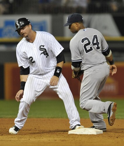 CHICAGO, IL - AUGUST 01:  A.J. Pierzynski #12 of the Chicago White Sox is doubled off of second base by Robinson Cano #24 of the New York Yankees in the fifth inning on August 1, 2011 at U.S. Cellular Field in Chicago, Illinois.  <br /><br /><span class="help">(Photo by David Banks/Getty Images)</span>