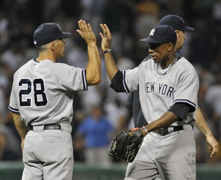 CHICAGO, IL - AUGUST 01: Joe Girardi #28 manager of the New York Yankees and Curtis Granderson #14 celebrate the Yankees 3-2 victory against the Chicago White Sox on August 1, 2011 at U.S. Cellular Field in Chicago, Illinois.  <br /><br /><span class="help">(Photo by David Banks/Getty Images)</span>