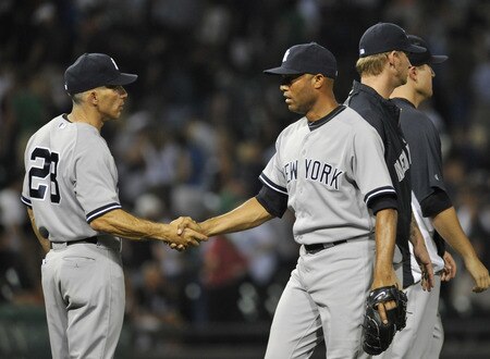 CHICAGO, IL - AUGUST 01: Joe Girardi #28 manager of the New York Yankees and Mariano Rivera #42 celebrate the Yankees 3-2 victory against the Chicago White Sox on August 1, 2011 at U.S. Cellular Field in Chicago, Illinois.  <br /><br /><span class="help">(Photo by David Banks/Getty Images)</span>
