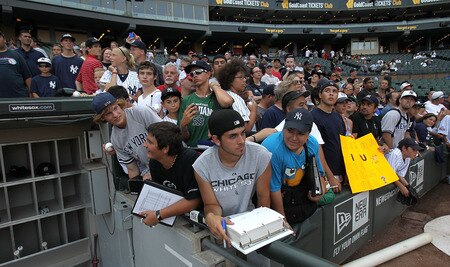 CHICAGO, IL - AUGUST 02: Fans watch as the New York Yankees take batting practice before a game against the Chicago White Sox at U.S. Cellular Field on August 2, 2011 in Chicago, Illinois. <br /><br /><span class="help">(Photo by Jonathan Daniel/Getty Images)</span>