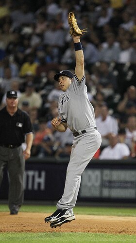 CHICAGO, IL - AUGUST 02: Mark Teixeira #25 of the New York Yankees leaps to make a catch, robbing Juan Pierre of the hicago White Sox at U.S. Cellular Field on August 2, 2011 in Chicago, Illinois. <br /><br /><span class="help">(Photo by Jonathan Daniel/Getty Images)</span>