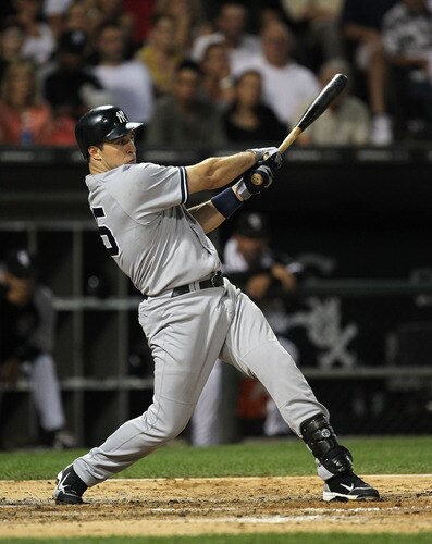 CHICAGO, IL - AUGUST 02:  Mark Teixeira #25 of the New York Yankees gets a hit against the Chicago White Sox at U.S. Cellular Field on August 2, 2011 in Chicago, Illinois.  <br /><br /><span class="help">(Photo by Jonathan Daniel/Getty Images)</span>