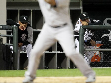 CHICAGO, IL - AUGUST 02: Bench coach Joey Cora #28 (L) and manager Ozzie Guillen #13 of the Chicago White Sox watch their team as they take on the New York Yankees at U.S. Cellular Field on August 2, 2011 in Chicago, Illinois. <br /><br /><span class="help">(Photo by Jonathan Daniel/Getty Images)</span>