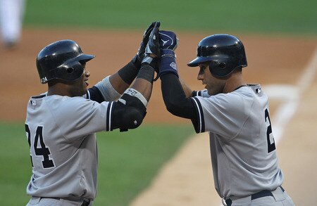 CHICAGO, IL - AUGUST 03:  Robinson Cano #24 of the New York Yankess is greeted by teammate Derek Jeter #2 after hitting a three-run home run in the 1st inning against the Chicago White Sox at U.S. Cellular Field on August 3, 2011 in Chicago, Illinois.  <br /><br /><span class="help">(Photo by Jonathan Daniel/Getty Images)</span>