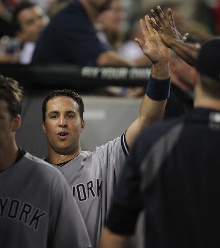 CHICAGO, IL - AUGUST 03:  Mark Teixiera #25 of the New York Yankees is greeted by teammates in the dugout after hitting a run-scoring triple and then scoring in the 3rd inning against the Chicago White Sox at U.S. Cellular Field on August 3, 2011 in Chicago, Illinois.  <br /><br /><span class="help">(Photo by Jonathan Daniel/Getty Images)</span>