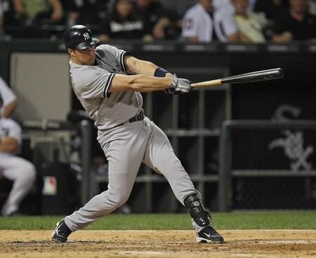 CHICAGO, IL - AUGUST 03:  Mark Teixiera #25 of the New York Yankees hits a run-scoring triple in the 3rd inning against the Chicago White Sox at U.S. Cellular Field on August 3, 2011 in Chicago, Illinois.  <br /><br /><span class="help">(Photo by Jonathan Daniel/Getty Images)</span>