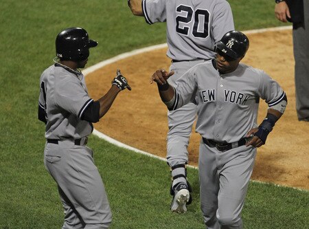 CHICAGO, IL - AUGUST 03: Curtis Granderson #14 (L) and Robinson Cano #24 of the New York Yankees celebrate scoring runs in the 7th inning against the Chicago White Sox at U.S. Cellular Field on August 3, 2011 in Chicago, Illinois. <br /><br /><span class="help">(Photo by Jonathan Daniel/Getty Images)</span>