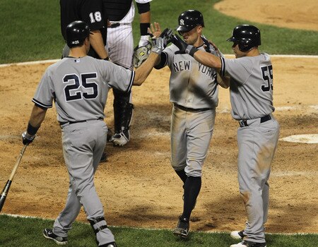 CHICAGO, IL - AUGUST 03:  Mark Teixiera #25 of the New York Yankees greets teammates Russell Martin #55 and Brett Gardner #11 as they score runs in the 7th inning against the Chicago White Sox at U.S. Cellular Field on August 3, 2011 in Chicago, Illinois.  <br /><br /><span class="help">(Photo by Jonathan Daniel/Getty Images)</span>