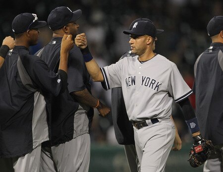 CHICAGO, IL - AUGUST 03: Derek Jeter #2 of the New York Yankees celebrates a win with teammates over the Chicago White Sox at U.S. Cellular Field on August 3, 2011 in Chicago, Illinois. The Yankees defeated the White Sox 18-7. <br /><br /><span class="help">(Photo by Jonathan Daniel/Getty Images)</span>