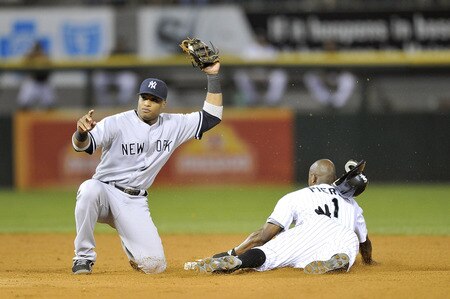 CHICAGO, IL - AUGUST 04:  Second baseman Robinson Cano #24 of the New York Yankees tags out a stealing Juan Pierre #1 of the Chicago White Sox during the sixth inning at U.S. Cellular Field on August 4, 2011 in Chicago, Illinois.  <br /><br /><span class="help">(Photo by Brian Kersey/Getty Images)</span>
