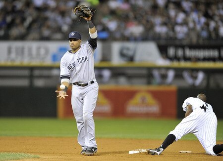 CHICAGO, IL - AUGUST 04:  Second baseman Robinson Cano #24 of the New York Yankees walks off the field after tagging out a stealing Juan Pierre #1 (R)of the Chicago White Sox during the sixth inning at U.S. Cellular Field on August 4, 2011 in Chicago, Illinois.  <br /><br /><span class="help">(Photo by Brian Kersey/Getty Images)</span>