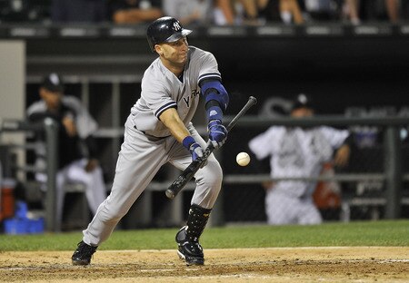 CHICAGO, IL - AUGUST 04:  Derek Jeter #2 of the New York Yankees lays down a sacrifice bunt to move teammate Brett Gardner #11 over to third base during the sixth inning against the Chicago White Sox at U.S. Cellular Field on August 4, 2011 in Chicago, Illinois.  <br /><br /><span class="help">(Photo by Brian Kersey/Getty Images)</span>