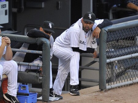 CHICAGO, IL - AUGUST 04:  Manager Ozzie Guillen #13 (R) of the Chicago White Sox and bench coach Joey Cora #28 stand in the dugout during the second inning at U.S. Cellular Field on August 4, 2011 in Chicago, Illinois.  <br /><br /><span class="help">(Photo by Brian Kersey/Getty Images)</span>