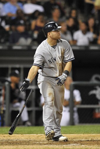 CHICAGO, IL - AUGUST 04:  Russell Martin #55 of the New York Yankees admires his three-run home run scoring Nick Swisher and Eric Chavez during the ninth inning against the Chicago White Sox at U.S. Cellular Field on August 4, 2011 in Chicago, Illinois. The Yankees won 7-2.  <br /><br /><span class="help">(Photo by Brian Kersey/Getty Images)</span>