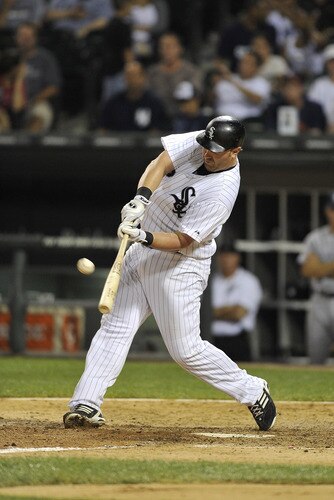CHICAGO, IL - AUGUST 04:  Adam Dunn #32 of the Chicago White Sox connects on a solo home run during the ninth inning against the New York Yankees at U.S. Cellular Field on August 4, 2011 in Chicago, Illinois. The Yankees won 7-2.  <br /><br /><span class="help">(Photo by Brian Kersey/Getty Images)</span>