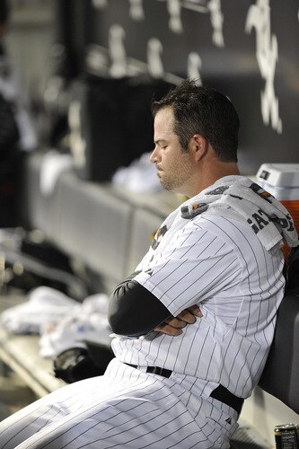 CHICAGO, IL - AUGUST 04:  Relief pitcher Brian Bruney #40 of the Chicago White Sox sits on the bench after giving up a three-run home run to Russell Martin #55 of the New York Yankees scoring Nick Swisher and Eric Chavez during the ninth inning at U.S. Cellular Field on August 4, 2011 in Chicago, Illinois. The Yankees won 7-2.  <br /><br /><span class="help">(Photo by Brian Kersey/Getty Images)</span>