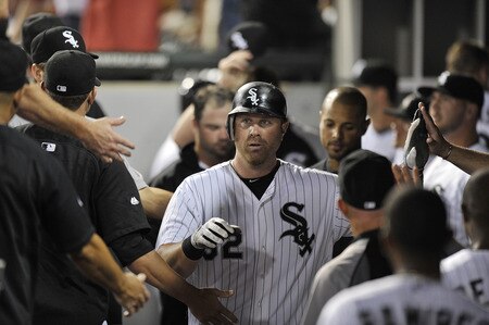 CHICAGO, IL - AUGUST 04:  Adam Dunn #32 of the Chicago White Sox is congratulated by teammates in the dugout after hitting a solo home run during the ninth inning against the New York Yankees at U.S. Cellular Field on August 4, 2011 in Chicago, Illinois. The Yankees won 7-2.  <br /><br /><span class="help">(Photo by Brian Kersey/Getty Images)</span>