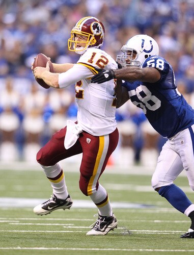 INDIANAPOLIS, IN - AUGUST 19:  John Beck #12 of the Washington Redskins is tackled by Gary Brackett #58 of the Indianapolis Colts during the game at Lucas Oil Stadium on August 19, 2011 in Indianapolis, Indiana.  <br /><br /><span class="help">(Photo by Andy Lyons/Getty Images)</span>