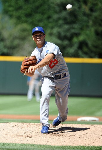 DENVER, CO - AUGUST 20:  Ted Lilly #29 of the Los Angeles Dodgers pitches during the game against the Colorado Rockies at Coors Field on August 20, 2011 in Denver, Colorado.  <br /><br /><span class="help">(Photo by Garrett W. Ellwood/Getty Images)</span>