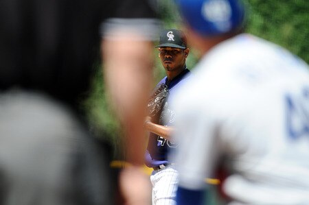 DENVER, CO - AUGUST 20:  Esmil Rogers #48 of the Colorado Rockies pitches during the game against the Los Angeles Dodgers at Coors Field on August 20, 2011 in Denver, Colorado.  <br /><br /><span class="help">(Photo by Garrett W. Ellwood/Getty Images)</span>