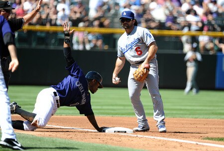 DENVER, CO - AUGUST 20:  Eric Young, Jr. #1 of the Colorado Rockies steals third base against Aaron Miles #6 of the Los Angeles Dodgers during the game at Coors Field on August 20, 2011 in Denver, Colorado.  <br /><br /><span class="help">(Photo by Garrett W. Ellwood/Getty Images)</span>