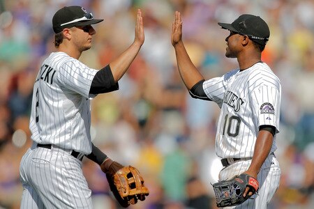 DENVER, CO - AUGUST 21:  Troy Tulowitzki #2 and Chris Nelson #10 of the Colorado Rockies celebrate their 5-3 victory over the Los Angeles Dodgers at Coors Field on August 21, 2011 in Denver, Colorado.  <br /><br /><span class="help">(Photo by Justin Edmonds/Getty Images)</span>