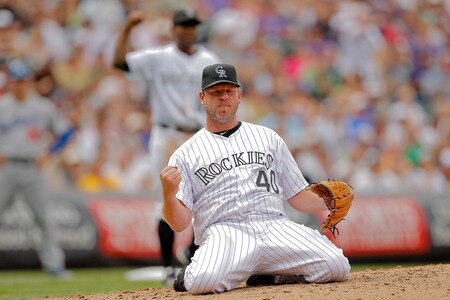 DENVER, CO - AUGUST 21:  Kevin Millwood #40 and Chris Nelson #10 of the Colorado Rockies react after Millwood started a double play against the Los Angeles Dodgers at Coors Field on August 21, 2011 in Denver, Colorado.  The Rockies defeated the Dodgers 5-3. <br /><br /><span class="help">(Photo by Justin Edmonds/Getty Images)</span>