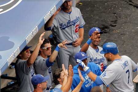 DENVER, CO - AUGUST 21:  James Loney #7 of the Los Angeles Dodgers is greeted by teammates at the top of the dugout after hitting a solo home run during the fourth inning against the Colorado Rockies at Coors Field on August 21, 2011 in Denver, Colorado.  <br /><br /><span class="help">(Photo by Justin Edmonds/Getty Images)</span>