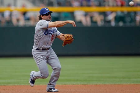 DENVER, CO - AUGUST 21:  Aaron Miles #6 of the Los Angeles Dodgers throws out Troy Tulowitzki #2 of the Colorado Rockies during the first inning at Coors Field on August 21, 2011 in Denver, Colorado.  <br /><br /><span class="help">(Photo by Justin Edmonds/Getty Images)</span>