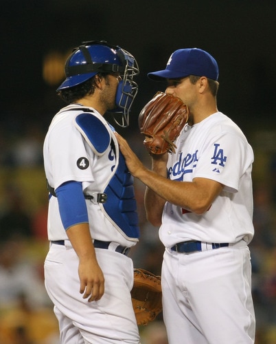 LOS ANGELES, CA - AUGUST 26:  Pitcher Ted Lilly #29 and catcher Rod Barajas #28 of the Los Angeles Dodgers talk at the mound during their MLB game against the Colorado Rockies at Dodger Stadium on August 26, 2011 in Los Angeles, California.  <br /><br /><span class="help">(Photo by Victor Decolongon/Getty Images)</span>