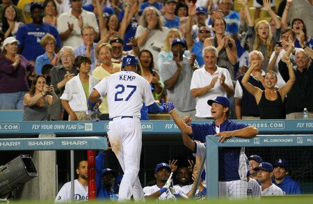 LOS ANGELES, CA - AUGUST 26:  Matt Kemp #27 of the Los Angeles Dodgers celebrates with manager Dan Mattingly after hitting a solo home run in the seventh inning against the Colorado Rockies during the MLB game at Dodger Stadium on August 26, 2011 in Los Angeles, California.  <br /><br /><span class="help">(Photo by Victor Decolongon/Getty Images)</span>