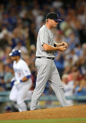 LOS ANGELES, CA - AUGUST 26:  Pitcher Matt Reynolds #51 of the Colorado Rockies looks on as James Loney #7 of the Los Angeles Dodgers rounds third base after hitting a two-run home run in the seventh inning during the MLB game at Dodger Stadium on August 26, 2011 in Los Angeles, California.  <br /><br /><span class="help">(Photo by Victor Decolongon/Getty Images)</span>
